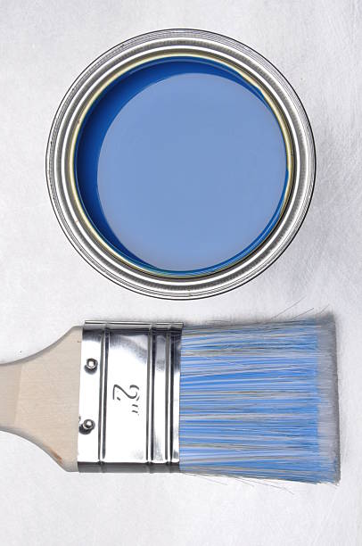 istock Top view of blue paint can with brush 498334972