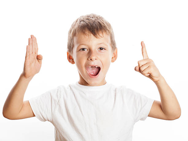 istock little cute white boy pointing in studio isolated close up 498335248