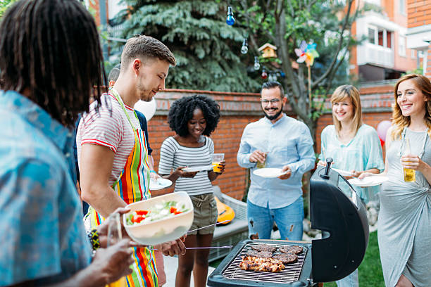 istock Young People Eating At Barbecue Party. 498335634