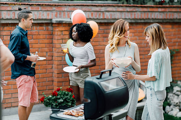 istock Young People Eating At Barbecue Party. 498335922