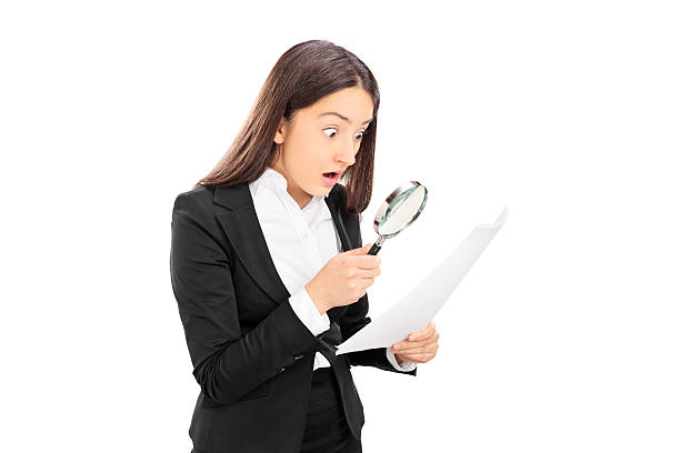 istock Shocked woman looking at document with scrutiny 498337095