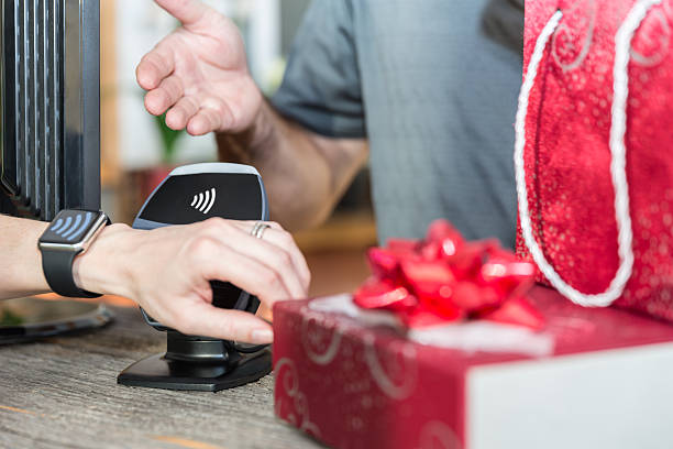 istock Woman Paying With NFC Technology on Smart Watch in Store 498337924