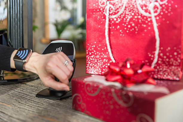istock Woman Paying With NFC Technology on Smart Watch in Store 498338190