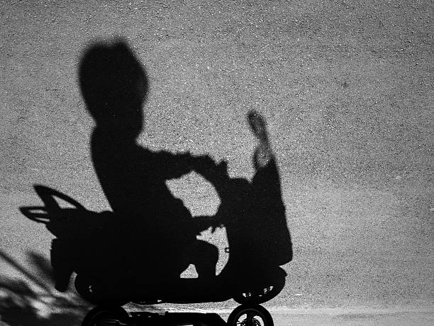 istock Shadow of a man riding motorcycle 498338616