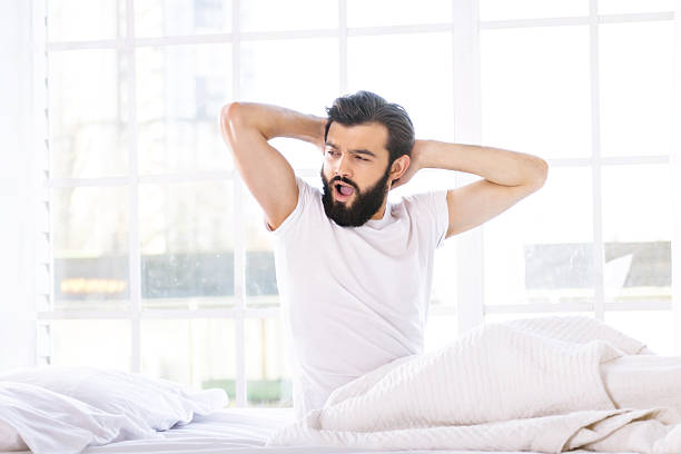 istock Sleepy young man in the morning 498338742