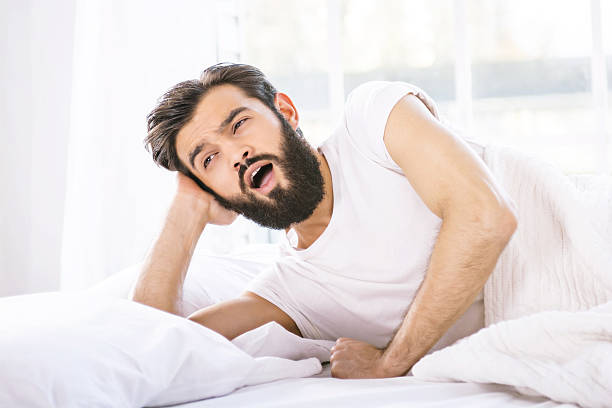 istock Sleepy young man in the morning 498338908