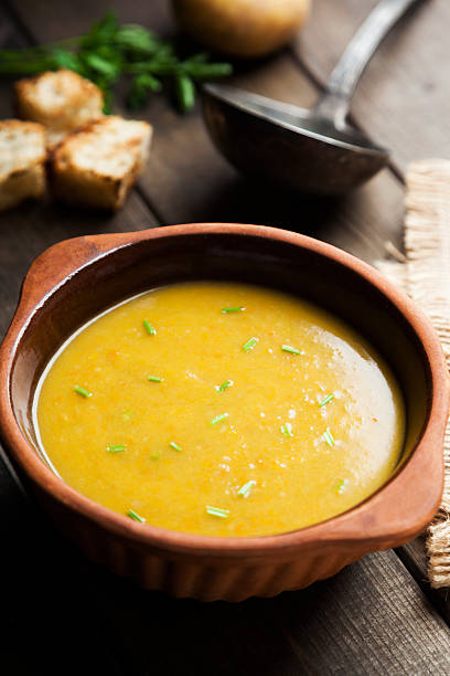 istock pumpkin and potatoes soup in earthenware bowl with toasted bread 498338940