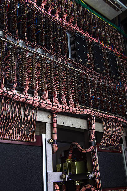 Wire-Filled Antique Supercomputer Close-up details of a 1970's-era industrial supercomputer, made up of tightly-wrapped coils of pink wire. computer mainframe old retro revival stock pictures, royalty-free photos & images