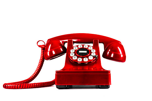 istock Old Fashioned Red Telephone Isolated on white 498339661