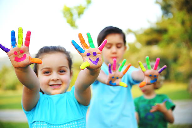 istock Children Showing Their Painted Hands 498339805