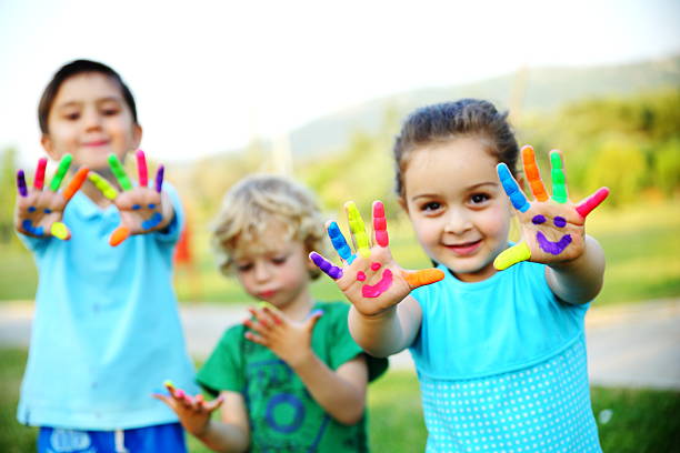 Children Showing Their Painted Hands.