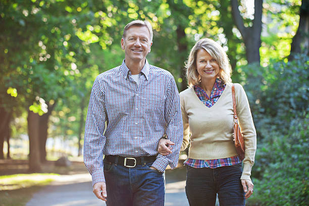 istock Mature couple taking a walk in the park 498340508