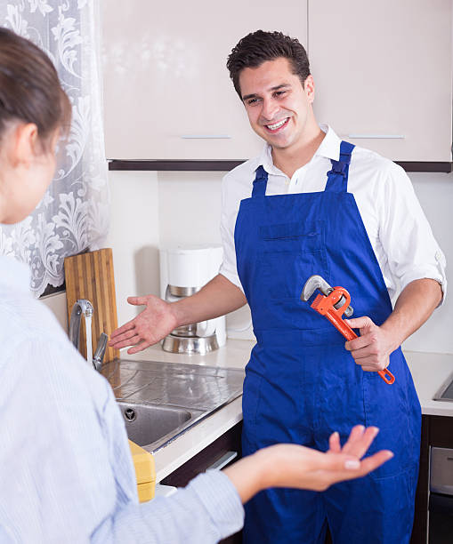 istock Housewife called professional plumber with tools to change  bibc 498340750