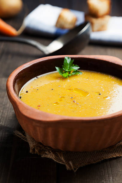 istock pumpkin and potatoes soup in earthenware bowl with toasted bread 498341422