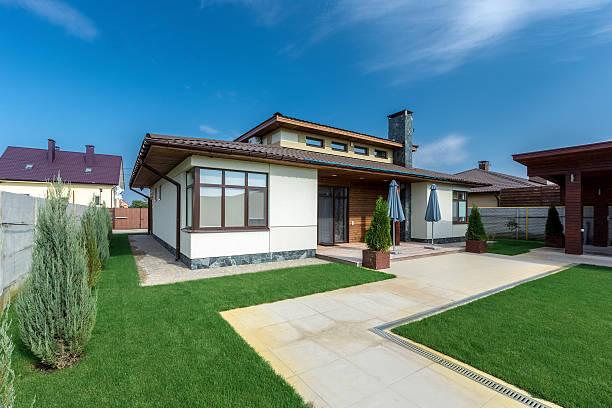 istock Beautiful modern house in cement, view from the garden 498341758