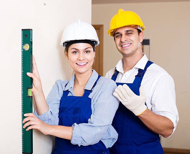 istock specialist and assistant working with wall in new building 498341802