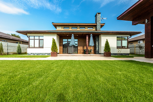 Beautiful modern house in cement, view from the garden.