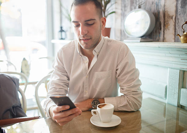 istock Smart phone in coffee shop 498341894