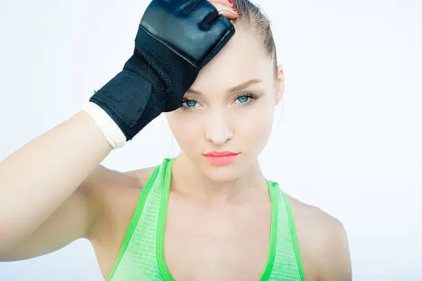 Beautiful UFC Women Fighter Posing With Her Gloves On.  Beautiful UFC Women Fighter Posing With Her Gloves On.