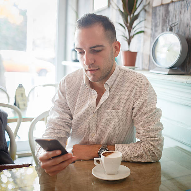 istock Smart phone in coffee shop 498342088