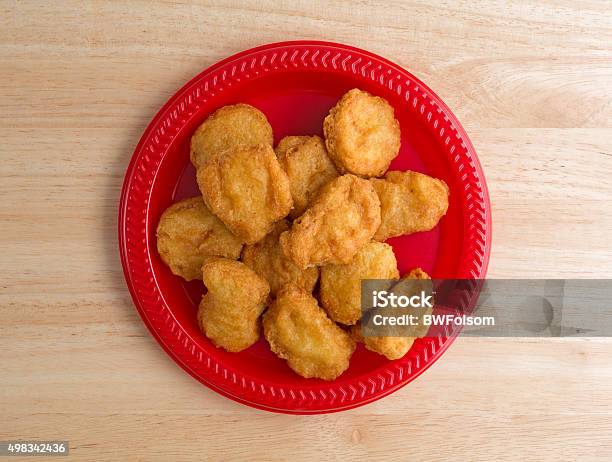 Chicken Nuggets On A Small Red Plate Stock Photo - Download Image Now - Chicken Nugget, Directly Above, Plate