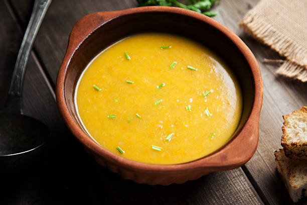 istock pumpkin and potatoes soup in earthenware bowl with toasted bread 498343360
