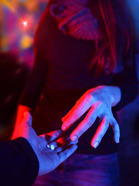 istock drug dealer at disco during spring break 498346270