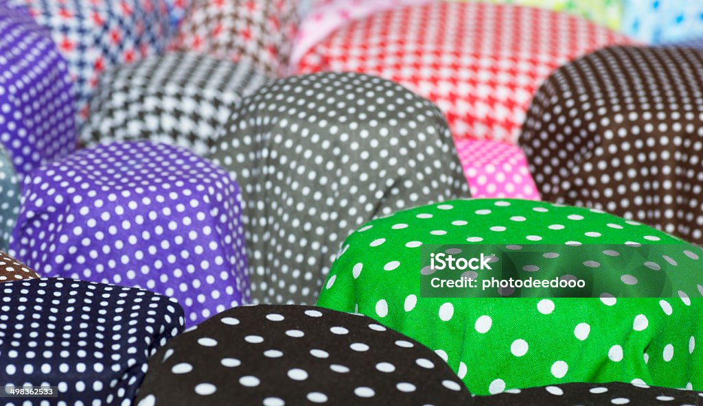 Rolls of colorful fabric as a vibrant background image Art And Craft Stock Photo