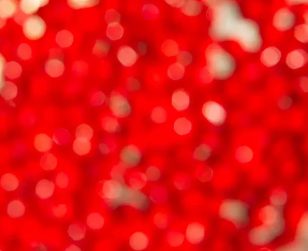 Red sandalwood seeds close up background in blur version.