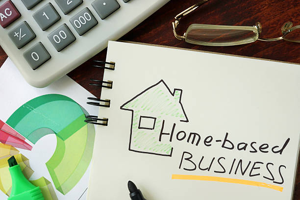 istock Notepad with Home-based business on the wooden table. 498366234
