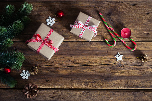 istock Christmas presents on a wooden background with candy 498366516