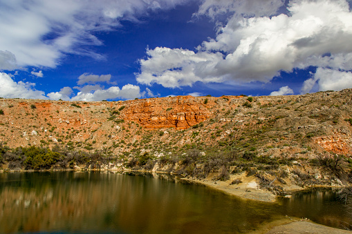 Desert lake surrounded by red sandstone in New Mexico
