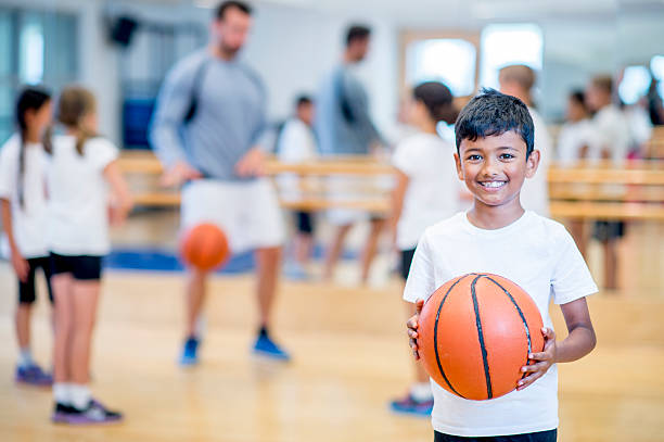 istock Happy Boy Playing Basketball 498367546