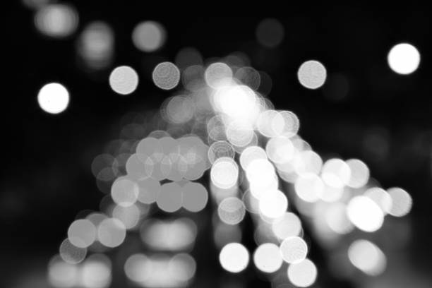 istock blured bokeh light in city in black and white tone 498369020