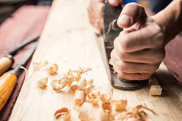istock Man working with hand jack plane, close up photo 498369764