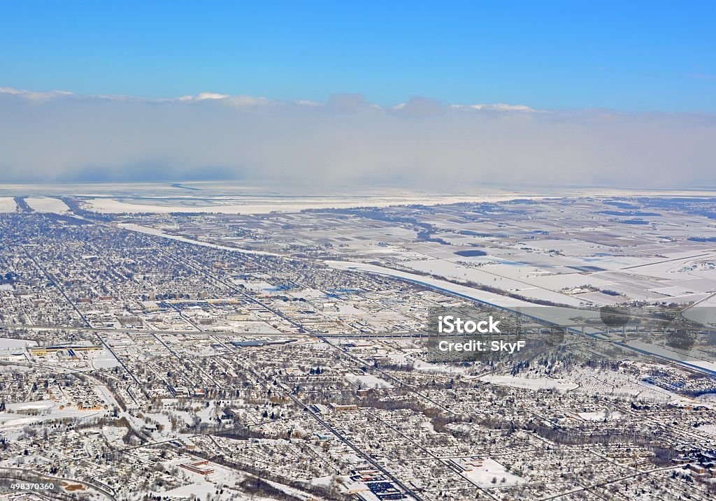 St Catharines Winter aerial aerial view across the city  St Catharines located on the Niagara Peninsulat during Winter, Niagara wine region and frozen Lake Ontario in the background; Ontario Canada Winter Stock Photo