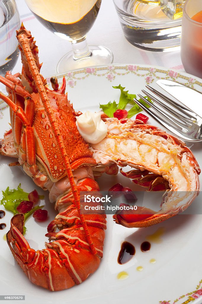 cooked lobster grilled lobster with endive, pomegranate and  vinaigrette Lobster - Seafood Stock Photo