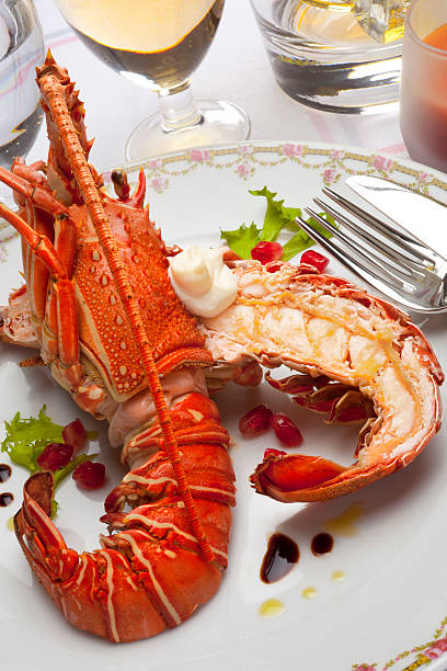 cooked lobster grilled lobster with endive, pomegranate and  vinaigrette agua volcano photos stock pictures, royalty-free photos & images