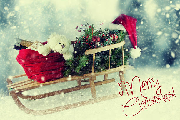 istock Sleigh with gifts and Christmas tree on nature background. 498371032
