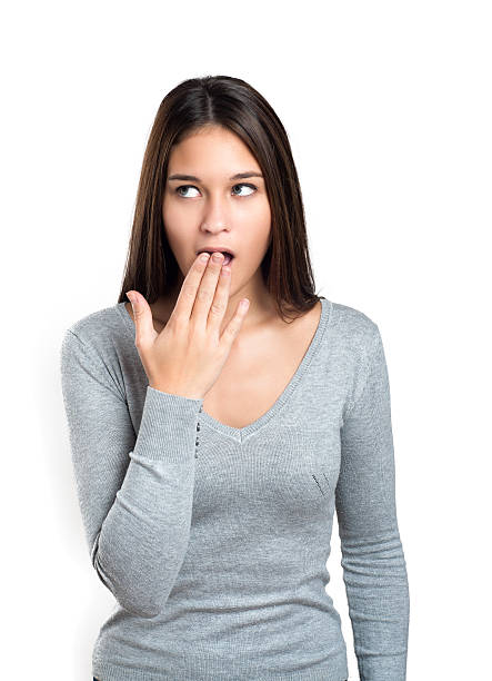 istock Shocked girl covers her opened mouth with hand 498372988