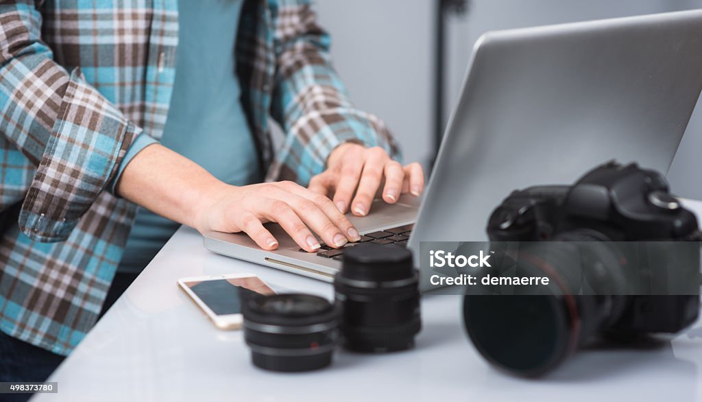 Photo studio Female photographer working in her studio hands close up and digital camera on foreground Photo Shoot Stock Photo