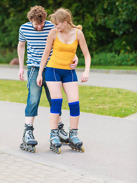 istock Young couple on roller skates riding outdoors 498373820
