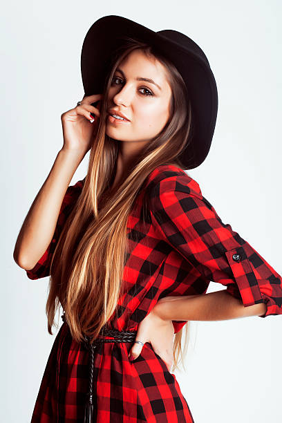 istock young pretty brunette girl hipster in hat on white background 498375974