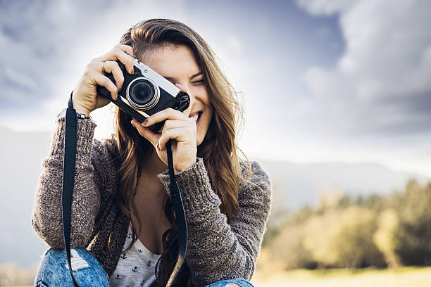 istock Young photographer shooting in nature 498377020