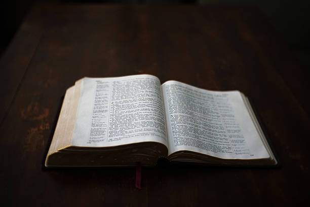 istock Open Bible Laying On Wooden Table 498377888