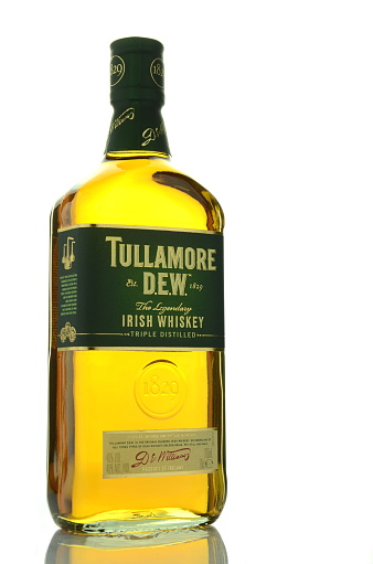 Kwidzyn, Poland - April 11, 2015: Tullamore Dew whiskey isolated on white background. Tullamore Dew is blended Irish whiskey produced by William Grant and Sons since 1829