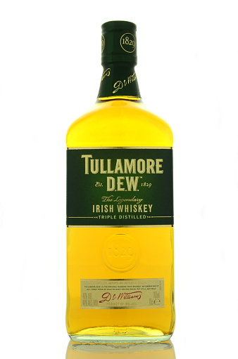 Kwidzyn, Poland - April 9, 2015: Tullamore Dew whiskey isolated on white background. Tullamore Dew is blended Irish whiskey produced by William Grant and Sons since 1829