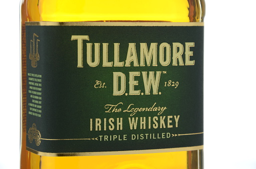 Kwidzyn, Poland - April 17, 2015: Tullamore Dew whiskey isolated on white background. Tullamore Dew is blended Irish whiskey produced by William Grant and Sons since 1829