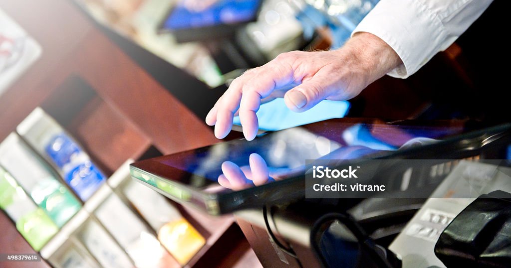 Bartender at the point of sale terminal Cash Register Stock Photo
