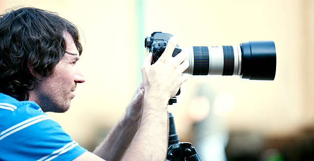 istock Photographers with Telephoto Lens 498379856